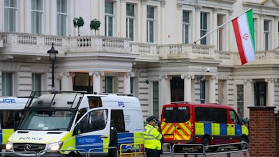 Police officers stand at a cordon outside the Iranian embassy in London. Bloomberg