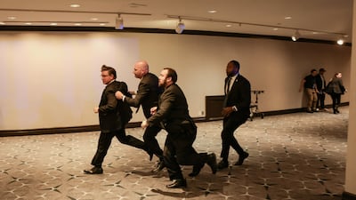 U. S. House Speaker Mike Johnson (R-LA) is evacuated as a shooter opens fire during the annual White House Correspondents' Association dinner in Washington, D. C. , U. S. , April 25, 2026. REUTERS / Jonathan Ernst