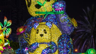 Pandas greet people to the neon wonderland