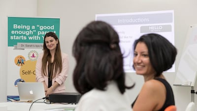 Empathy can create better behaviour in children, say experts including Dr Sarah Rasmi, seen with parents Purvi Kotecha and Sarah Ghobrial at Kids HQ. Antonie Robertson / The National