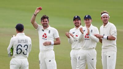 England bowler James Anderson, second left, celebrates reaching 600 Test wickets during the drawn third Test against Pakistan. Getty