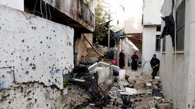 Palestinians near the site of a drone strike in Nour Shams refugee camp in Tulkarm in the Israeli-occupied West Bank on August 27. Reuters