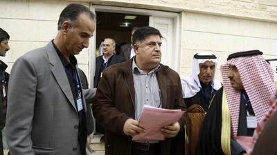 Amer Al Halloush, a member of the Syrian Democratic Council, an alliance formed in December as the political branch of the Kurdish-Arab fighting force known as the Syrian Democratic Forces, heads out of a meeting of more than 150 delegates from Kurdish, Arab, Assyrian and other parties in the town of Rmeilan, in Syria’s northeastern Hasakeh province, on March 16, 2016. Delil Souleiman AFP