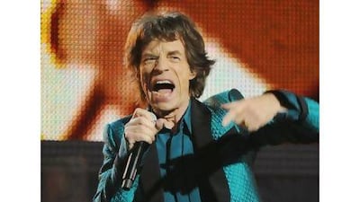 Mick Jagger inspired Barack Obama to sing the blues. Mark Ralston / AFP
