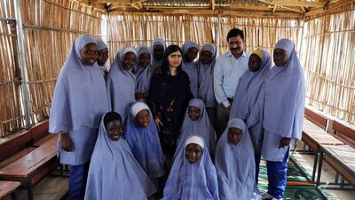 Malala with her father Ziauddin Yousafzai, and students at the Unicef-funded school at Bakassi camp in Maiduguri. Afolabi Sotunde