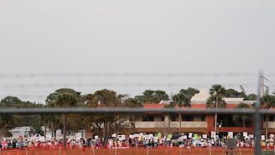 Air Force One with US President Donald Trump on board arrives for a rally in Florida, where Trump claimed he had secured a reduction in the cost of a new jet. Gregg Newton / AFP