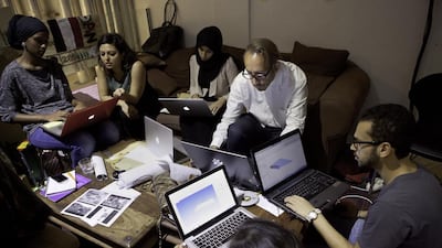 Architecture professor George Katodrytis (top-white shirt) with a group of architects and designers working on the design of an orphanage in Tanzania. Jaime Puebla / The National Newspaper