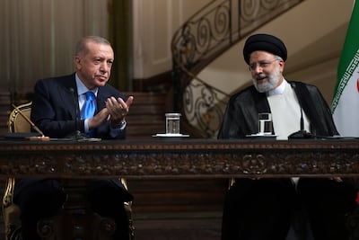 Turkish President Recep Tayyip Erdogan with Iranian President Ebrahim Raisi at Saadabad Palace in Tehran, in July 2022. AP