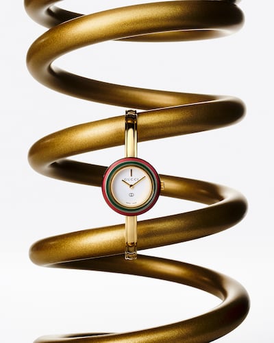 Gucci revisits its playful 1980s watch design with six interchangeable ceramic bezels, allowing the wearer to change the colour to complement an outfit. Photo by Bobby Doherty