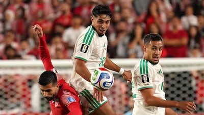 Algeria's Fares Chaibi and Nadhir Benbouali in action with Jordan's Noor Al Rawabdeh. Reuters