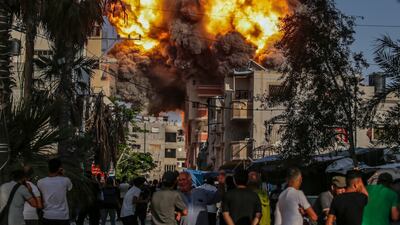 An Israeli air strike hits Al Bureije refugee camp in southern Gaza on Monday. Attempts to gain support for a ceasefire plan at the UN are welcome but come too late for the tens of thousands of Palestinians who have lost their lives. EPA