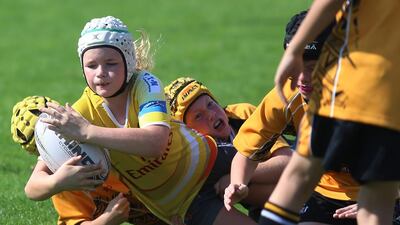 The Dubai Hurricanes offender maintains control of the ball despite a tackle from Al Ain during game action on Friday, January 22, 2016, at the HSBC Rugby Festival Dubai. DELORES JOHNSON / The National