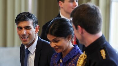 British Prime Minister Rishi Sunak and his wife Akshata Murty arrive at the event. Reuters