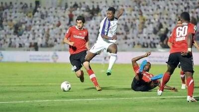 Asamoah Gyan, centre, is on a one-year loan at Al Ain from parent club Sunderland. Anas Kanni / Al Ittihad