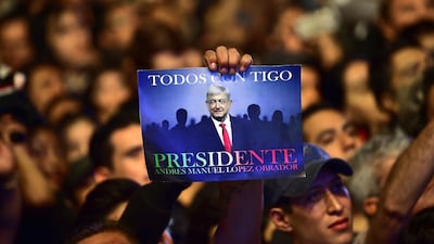 Supporters of the presidential candidate for the "Juntos haremos historia" coalition, Andres Manuel Lopez Obrador, celebrate at the Zocalo square in Mexico City, after getting the preliminary results of the general elections on July 1, 2018. Anti-establishment leftist Andres Manuel Lopez Obrador won Mexico's presidential election Sunday by a large margin, according to exit polls, in a landmark break with the parties that have governed for nearly a century. Pedro Pardo / AFP