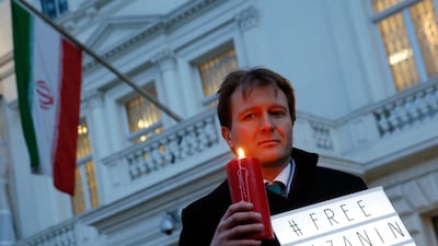 Husband of imprisoned charity worker Nazanin Zaghari-Ratcliffe, Richard Ratcliffe, poses for the media during an Amnesty International led vigil outside the Iranian Embassy in London. Ratcliffe said on Tuesday that his wife may face new charges. Alastair Grant / AP