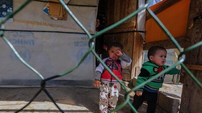 Syrian refugee children seen inside a tent as UN high commissioner Filippo Grandi visits a refugee camp in Mohammara, Akkar province in northern Lebanon. EPA