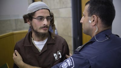 Meir Ettinger appears in court in Nazareth Illit last August. Ariel Schalit, File/AP Photo