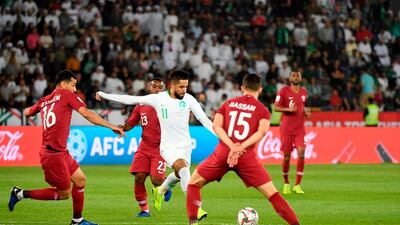 Saudi Arabia midfielder Hatan Bahbri, centre, has a shot on goal against Qatar in the 2019 Asian Cup. AFP