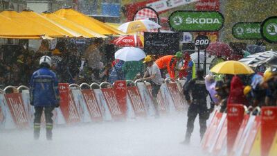 Heavy rain and hailstones in the finish area of the ninth stage of the 103rd Tour de France cycling race over 184.5km between Vielha Val d’Aran and Andorre Arcalis, Andorra, 10 July 2016. Yoan Valat / EPA