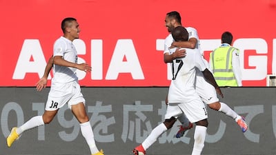 Kyrgyzstan's players celebrate taking the lead. AFP