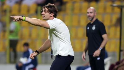 Al Wasl manager Milos Milojevic gives instructions to his players.