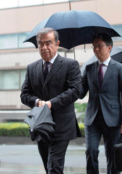 Former Nissan Motor Chairman Carlos Ghosn (L) arrives for a pre-trial hearing at the Tokyo District Court in Tokyo, prior to his escape from Japan. AFP Photo