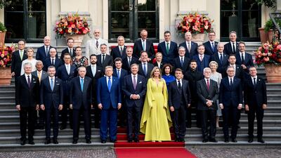 King Willem-Alexander and Queen Maxima of the Netherlands join a photo of leaders. Reuters