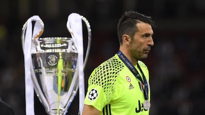 Gianluigi Buffon of Juventus walks past the Uefa Champions League trophy after losing to Real Madrid 4-1 in the final at National Stadium of Wales on June 3, 2017 in Cardiff, Wales. Matthias Hangst / Getty Images