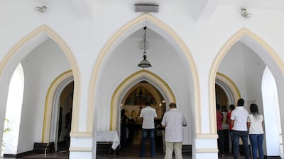 Sri Lankan Catholic devotees pray during a mass at the St. Theresa's church as the Catholic churches hold services again after the Easter attacks in Colombo on May 12, 2019. Thousands of Catholics attended mass in Sri Lanka's capital Colombo on May 12 amid tight security to prevent a repeat of Easter bomb attacks that killed 258 people. / AFP / LAKRUWAN WANNIARACHCHI