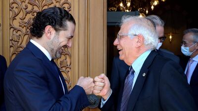 Lebanese Prime Minister-Designate Saad Hariri, left, greets European Union foreign policy chief Josep Borrell with a fist bump, in Beirut, Lebanon, on Saturday. Image: AP
