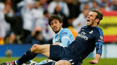 David Silva, left, is an injury doubt for the return leg in Madrid. Jason Cairnduff / Reuters