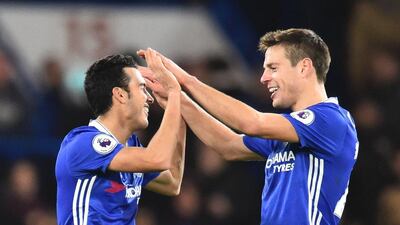 Chelsea's Pedro, left, celebrates scoring a goal against Bournemouth with Cesar Azpilicuetaat Stamford Bridge in London on December 26, 2016. Glyn Kirk / AFP