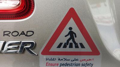The decals that are being displayed on cars to promote pedestrian safety awareness project among drivers in Abu Dhabi. Delores Johnson / The National