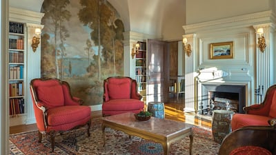 Fireplaces are finished in marble and wood, walls are hand-painted and covered with murals, and the 14-foot ceilings are decorated with friezes and medallions. Courtesy The Knowles Company Realtors