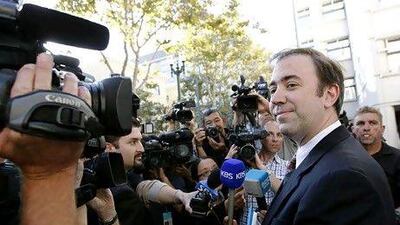 Jason Bartlett, counsel for Apple, speaks with reporters following the jury's decision. Reuters