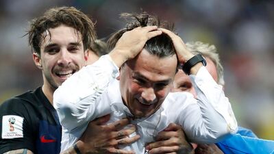 Croatia head coach Zlatko Dalic celebrates with his team after reaching the World Cup final. AP Photo