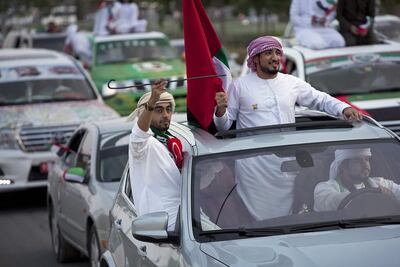 People celebrate National Day at the Union Car Parade on Yas Island. Silvia Razgova / The National