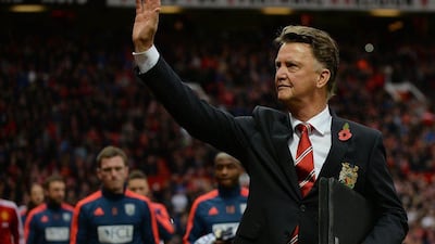 Manchester United manager Louis van Gaal waves to fans before his team's Premier League win over West Brom on Saturday. Peter Powell / EPA / November 7, 2015