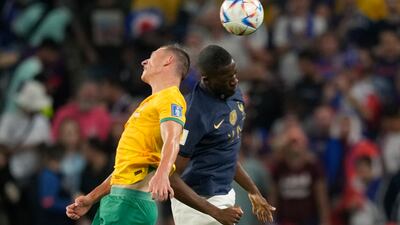 Australia's Mitchell Duke and France's William Saliba battle. AP