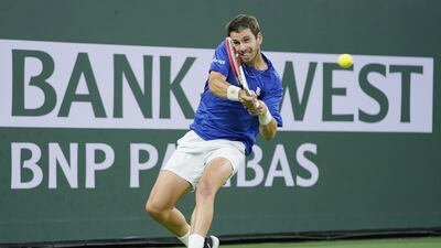 Cameron Norrie of Great Britain hits a return to Nikoloz Basilashvili of Gerogia. EPA