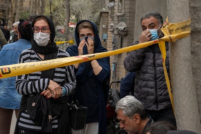 People gather near the site of a strike on northern Tehran. Getty Images