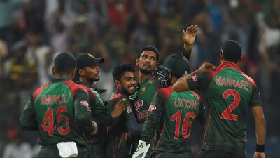 Bangladesh cricketer Mahmudullah, centre, celebrates with his teammates after he dismissed Pakistan batsman Imam-ul-Haq during an Asia Cup match in Abu Dhabi on September 26, 2018. AFP