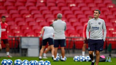 Barcelona manager Ernesto Valverde, right, watches his team during a training session at Wembley Stadium. AP Photo