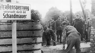 Soldiers building the Berlin Wall as instructed by the East German authorities, in order to strengthen the existing barriers dividing East and West Berlin in 1961 in Berlin, Germany. Saturday, August 13th 2011 will mark 50 Years Since East German Troops S???