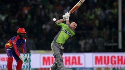 Ben Dunk of Lahore Qalandars plays a shot against Karachi Kings. EPA