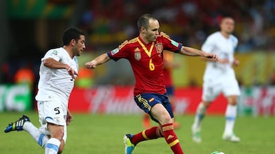 Andres Iniesta, right, of Spain has evolved his game in recent years, dropping deeper and dictating the play rather than just fuelling the attack. (Photo by Clive Mason/Getty Images)