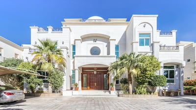 The imposing front entrance to the villa. Courtesy LuxuryProperty.com
