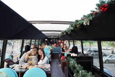 The double-decker bus travels a route that brings guests to some of Dubai's most famous attractions. Pawan Singh / The National
