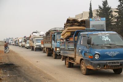 A convoy of people fleeing from Maarat Al Numan in northern Idlib. Mahmoud Hassano / Reuters
